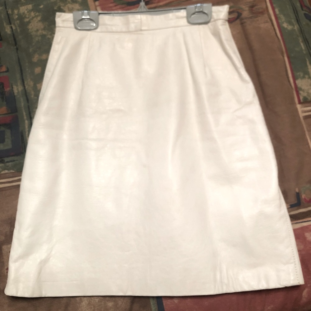 White leather skirt. Lined, size 4 but more like small 2 or 0. Bought in Mexico.